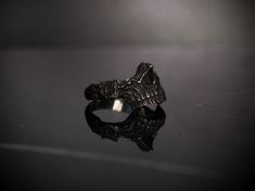 This skull ring features a dark fantasy upper jaw. Fully sculpted showing details from all angles. Solid sterling silver. Pictured ring is size 10. All rings I make to order and can take 1-2 weeks to ship unless I happen to have one in your size. Available in blackened, antiqued (as pictured, black with highlights polished) or full polish. Larger sizes are available just send me a message Unique Hand Cast Black Skull Ring, Black Hand Cast Skull Ring, Black Sterling Silver Skull Ring Hand Cast, Black Sterling Silver Hand Cast Skull Ring, Hand-cast Sterling Silver Black Skull Ring, Hand-cast Black Skull Ring In Sterling Silver, Black With Highlights, Skull Jewelry, Skull Ring