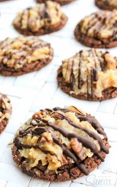 cookies with chocolate drizzle and nuts on top