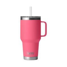 a pink yeti cup with a straw in it