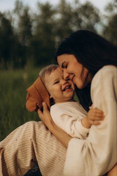 a woman holding a small child in her arms