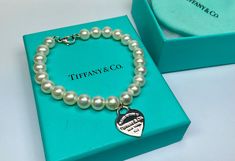 Tiffany And  Co. 925 Sterling Silver "Please Return To Tiffany & Co. New York" Heart Tag 7-8mm White Pearl Bracelet  !!! by GOLDKNOX on Etsy White Pearl Bracelet, Return To Tiffany, Heart Tag, Tiffany And Co, Pearl Size, Sterling Silver Heart, White Pearl, Charm Bracelets, Pearl Bracelet