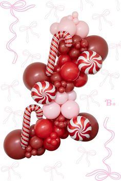 balloons and candy canes are arranged in the shape of an x