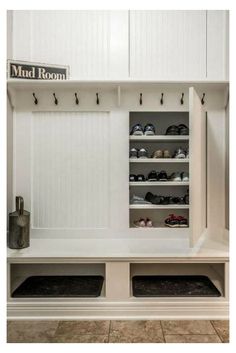 the mud room is clean and ready to be used as a shoe storage area for shoes