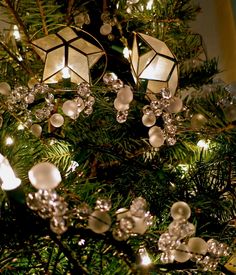 a christmas tree with ornaments and lights on it