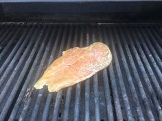 a piece of meat sitting on top of a grill