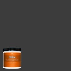 a can of behr paint on a blue background