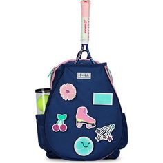 a blue backpack with patches and stickers on the front, hanging from a hook