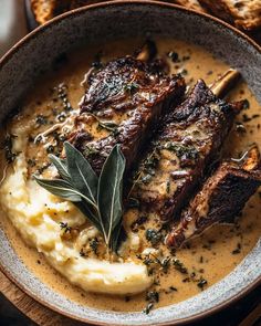 some meat and mashed potatoes in a bowl