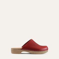 The Helena classic clog is one of our all-time favorites. It has the look of a traditional clog but on a flat base. Red leather. With its cushioned, flexible sole, the Helena clog is both stylish and easy to wear. Designed in Sweden and handmade in Italy. Heel: 3cm / 1.18" Inches Soft Padded footbed Flexible base with wood-like effect Classic Slip-on Clogs With Leather Sole, Classic Mules With Rubber Sole And Round Toe, Classic Flat Clogs With Rubber Sole, Classic Slip-on Clogs With Rubber Sole, Comfortable Flat Clogs With Rubber Sole, Slip-on Clogs With Rubber Sole And Plain Toe, Classic Slip-on Clogs With Plain Toe, Classic Leather Sole Slip-on Clogs, Leather Sole Slip-on Clogs With Plain Toe