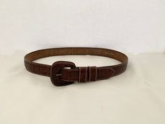 "This is a 100% leather belt by Esprit.  It is a dark brown mottled leather made to resemble reptile skin.  The buckle is covered in the same leather as the strap and it is accented with white stitching.  Esprit was founded in California in 1968. The belt is marked \"M\", \"75\", \"Esprit Real Leather\", and \"100% Leather\". If you purchase more than one item from my shop in the same order, I will automatically combine shipping costs and refund your overage.  You can browse my shop at www.etsy. Reptile Skin, Doll Party, Belt Length, Brown Leather Belt, Feathered Hairstyles, Lovely Shop, Suspender Belt, Suspenders, Leather Belt