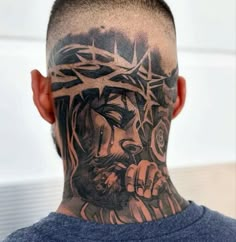 a man with a tattoo on his head