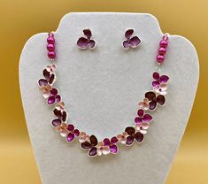 Bib necklace and earring set featuring pink and purple flower petals and colorful crystals.  Each piece has a custom length to fit all sizes.  Necklace is made from glass pearls and crystals to form a unique and stylish look.  Optional bracelet comes with an easy to use magnetic clasp.    I can convert any of the earrings from pierced to clip on style at no charge, please request this in notes with purchase.   Please do not hesitate to contact me with any questions, I would love to hear from you Silver Flower-shaped Metal Jewelry Sets, Pink Flower-shaped Metal Jewelry, Pink Adjustable Jewelry Sets For Gifts, Pink Flower-shaped Jewelry Sets For Gifts, Pink Floral Jewelry Sets For Gifts, Nickel-free Pink Flower-shaped Jewelry, Adjustable Pink Flower-shaped Jewelry, Pink Metal Jewelry For Mother's Day, Pink Metal Jewelry Sets For Gift