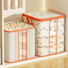 an orange and white storage bin next to a closet full of diapers