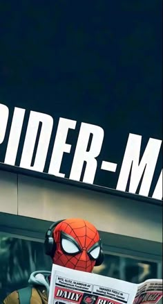 a spider - man reading a newspaper in front of a building with the word spider - man on it