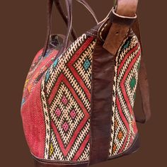 You're going to want to plan a weekend trip just so you can use this beautiful bag! Intertwined's beautifully crafted travel bag is handmade in Morocco from locally tanned leather and vintage, handwoven kilim. Each kilim is one-of-a-kind and handwoven with unique colors and patterns based on the region where it is made. Traditional Brown Rectangular Weekender Bag, Traditional Brown Travel Bag With Leather Handles, Rustic Travel Satchel Bag, Rustic Satchel For Travel, Traditional Brown Weekender Bag With Leather Handles, Traditional Woven Leather Shoulder Bag For Travel, Traditional Tote Weekender Bag For Travel, Traditional Travel Bags With Leather Handles, Traditional Travel Satchel With Leather Handles