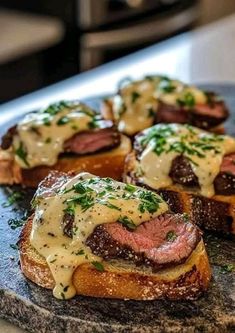 several pieces of bread topped with meat and cheese