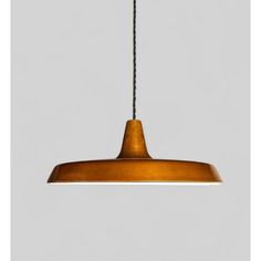 a wooden light hanging from a ceiling fixture with a black cord in front of it