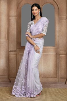 Lilac net saree with floral pattern, tonal sequin, cut dana, thread and beads embroidery. Paired with V neck padded blouse with all over floral checkered pattern embroidery.
Components: 2
Pattern: Embroidered
Type Of Work: Sequin, Thread, Beads and Cut Dana Work
Neckline: V Neck
Sleeve Type: Half Sleeves
Fabric: Net
Color: Purple
Other Details: 
Sheer back
Blouse Closure: Side concealed zip
Occasion: Wedding,Reception - Aza Fashions Thread Beads, Saree And Blouse, Beads Embroidery, Padded Blouse, Saree For Women, Embroidered Saree, Net Saree, Pattern Embroidery, Organza Saree