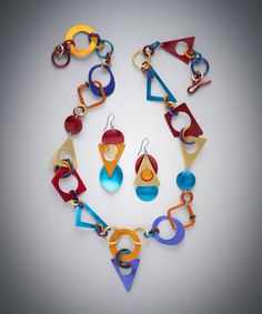 Discover The Purrrfect Toy Earrings & Necklace by Sylvi Harwin, and get inspired by more original art and unique treasures created by artists. Shop now! Bold Jewelry With Matching Dangle Earrings, Bold Geometric Earrings With Bold Design, Modern Multicolor Dangle Jewelry, Modern Multicolor Jewelry With Bold Design, Bold Geometric Designed Earrings, Modern Multicolor Geometric Jewelry, Modern Red Geometric Jewelry, Modern Multicolor Earrings With Bold Design, Unique Multicolor Geometric Jewelry