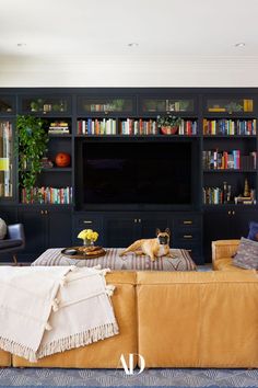 a living room filled with furniture and a flat screen tv