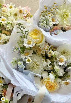 several bouquets of flowers are laid out on the ground