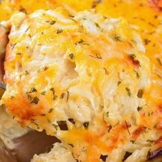 a casserole dish with chicken and cheese on it's side, ready to be eaten