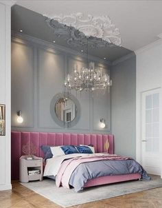 a bedroom with a bed, chandelier and mirror on the wall above it