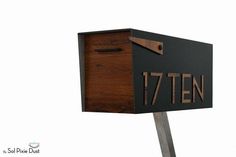 a mailbox with the number seven ten on it's front and side panels