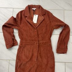 Brand New With Tags. Size Medium. Buttons Down The Front With Front Zipper. Flared Pant Legs. Red Jumpsuits And Rompers For Work In Fall, Red Jumpsuit For Workwear In Fall, Red Jumpsuit For Work In Fall, Fitted Jumpsuits And Rompers For Fall Date Night, Fitted Jumpsuits And Rompers With Pockets For Date Night, Red Overall Jumpsuit For Fall, Fitted Jumpsuits And Rompers For Fall Day Out, Red Fitted Jumpsuits For Day Out, Fitted Long Sleeve Jumpsuits And Rompers For Day Out