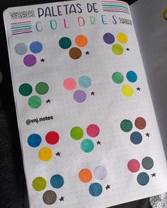 an open notebook with colorful circles on it