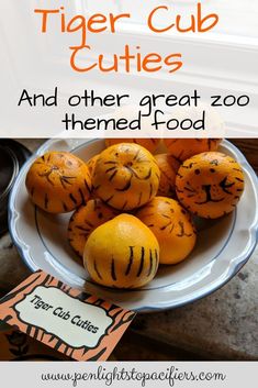 tiger cub cuties and other great zoo themed food on a white plate with oranges