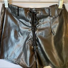 Nasty Gal Size 4 Faux Leather Shorts! New Without Tags, Invisible Side Zipper For A Secure Fit. Laced Up The Front With Belt Tabs On Either Side. Style With Knee High Boots, Oversized Sweater Or A Blazer, Tank & Mile High Stilettos! Grab A Hat And You’re On Trend Faux Leather Short Bottoms For Party, Short Faux Leather Party Bottoms, Summer Faux Leather Bottoms For Club, Casual Faux Leather Shorts For Party, Casual Faux Leather Party Shorts, Edgy Faux Leather Party Shorts, Faux Leather High-waisted Shorts For Going Out, Spring Faux Leather High-waisted Shorts, Trendy High-waisted Leather Shorts