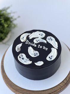 a cake with white frosting and black icing that says, bride to be