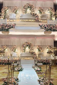 the wedding stage is decorated with flowers and candles