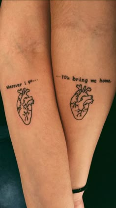 two people with tattoos on their legs that say, you're bring me home