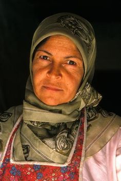 an old woman with a scarf on her head