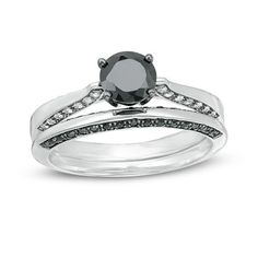 a black and white diamond ring set on top of each other with two matching bands