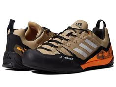 adidas Outdoor Terrex Swift Solo 2 - Athletic Shoes : Beige Tone/Grey One/Flash Orange : Play your favorite sports or go for hiking wearing adidas Outdoor Terrex Swift Solo 2 footwear. Textile upper. Textile lining and molded sockliner. Molded toe cap. Lace closure. EVA stabilization frame and boost midsole. External heel support clip. Abrasion-resistant welding. Rubber outsole with rough terrain zone. Imported. Weight of footwear is based on a single item, not a pair. Waterproof Low-top Trail Running Shoes For Climbing, Durable Casual Trail Running Shoes For Sports, Lightweight Durable Sneakers For Outdoor, Durable Trail Running Shoes For Sports, Waterproof Casual Hiking Boots For Climbing, Casual Waterproof Hiking Boots For Climbing, Adidas Dynamic Trail Running Shoes, Adidas Trail Running Shoes For Hiking, Adidas Breathable Functional Trail Running Shoes