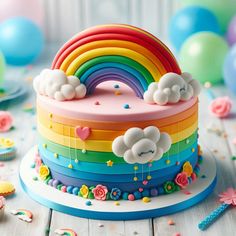 a rainbow cake with clouds and flowers on it