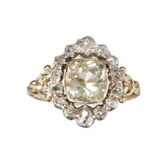 A French antique, Louis Philippe I period, cluster ring, in the Georgian style, set with a cushion cut, pale yellow, citrine, in a gold rub over setting, with an old mine-cut diamond surround, in silver, cut down, closed back settings, on a decorative gold shank, with carved shoulders, with a French eagle head mark, for 18ct gold, circa 1840. Period: Circa 1840 Style: Georgian Metal: Silver and gold Stone: Citrine and diamond Finger Size: L ½ UK / 5 7/8 US Country Of Origin: France Condition: Go Luxury Heirloom Diamond Ring In Recycled Gold, Luxury Heirloom Rings In Recycled Gold, Luxury Heirloom Gold-plated Ring, Luxury Gold Heirloom Diamond Ring, Luxury Yellow Gold Heirloom Cluster Ring, Luxury Heirloom Ring With High Luster, Luxury Heirloom Yellow Gold Cluster Ring, Luxury Victorian Yellow Gold Rings, Luxury Antique Yellow Gold Rings