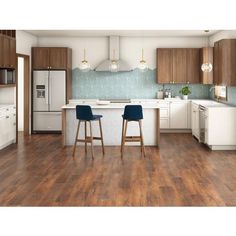 an image of a kitchen setting with bar stools in the center and wood flooring