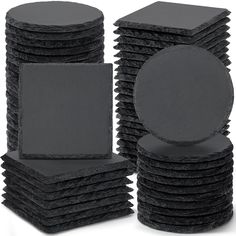 a stack of black sponge pads on top of each other in front of a white background