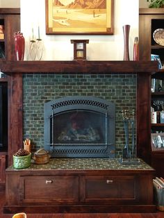 a living room with a fire place and bookshelves