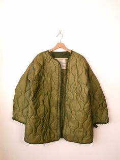 "Unworn-Vintage US Military Jacket Lining/Army Quilted Liner. Measurements Tagged size : Extra Small ( it runs bigger. Please check the measurements below.)  Length: 31\" Armpit to armpit: 24\" Shoulder: 20\" Shoulder to end of sleeve: 22\" Condition: Unworn. A thread on armpit is undone as shown in the last pic.  ※Please read the policy before you purchase※" Vintage Olive Long Sleeve Outerwear, Olive Vintage Long Sleeve Outerwear, Vintage Khaki Outerwear For Winter, Vintage Khaki Winter Outerwear, Vintage Khaki Fall Outerwear, Vintage Lined Outerwear For Winter, Vintage Lined Winter Outerwear, Vintage Green Outerwear For Fall, Green Vintage Outerwear For Fall