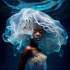 a woman wearing a white dress under water