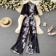 Palace style, irregular print jumpsuit, professional wear, temperament goddess style, slim long wide-leg pantsMaterial:blendedColor:as pictureStyle:goddess,palaceFeatures:professional ,temperament,slimSize(cm):S,M,L XL,2XL 1inch=2.54cmS:bust:82,shoulder:35,waist:68,sleeve:29,length:141&ltp&gtM:bust:84,shoulder:36,waist:70,sleeve:30,length:142</p>&ltbr/>&ltp&gtL:bust:88,shoulder:37,waist:72,sleeve:31,length:143</p>&ltbr/>&ltp&gtXL:bust:92,shoulder Spring Fitted Floor-length Jumpsuits And Rompers, Elegant Floral Print Jumpsuits And Rompers, Elegant Fitted Floral Jumpsuits And Rompers, Elegant Floral Print Short Sleeve Sets, Elegant Floral Print Jumpsuits And Rompers With Short Sleeves, Elegant Printed Summer Jumpsuits And Rompers, Elegant Floral Print Jumpsuit With Short Sleeves, Elegant Printed Jumpsuits And Rompers For Summer, Fitted Floral Print Wide Leg Jumpsuits And Rompers