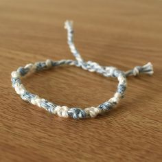 a close up of a bracelet on a table