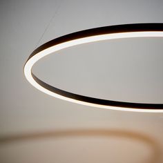 a circular light fixture hanging from the ceiling