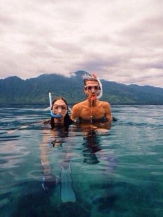 two people in the water with snorkels on their heads and text that reads bath in air