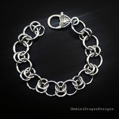 A nice and simple chainmaille bracelet yet a conversation starter! measures 7 inches.  Nickel free. Anodized Aluminum. Metal Link Bracelets With Rolo Chain, Metal Link Bracelets With Jump Ring, Metal Chainmail Bracelet, Hypoallergenic Metal Chain Link Bracelet, Metal Chain Link Charm Bracelet With Lobster Clasp, Silver Chainmail Bracelet With Chain Link, Silver Chainmail Chain Link Bracelets, Nickel-free Metal Chain Link Charm Bracelet, Silver Link Bracelet With Jump Ring